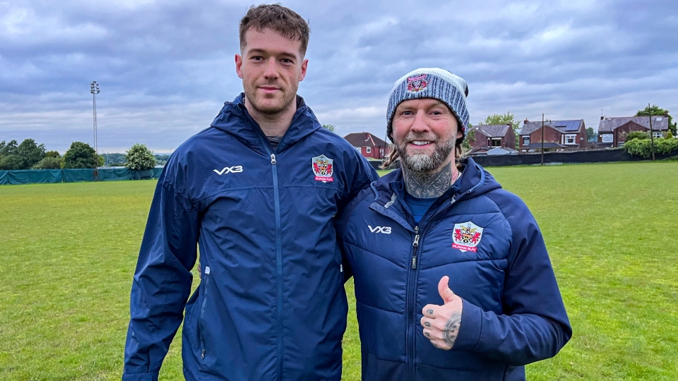 Nathan Roebuck is pictured with Roughyeds head coach Sean Long