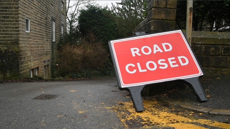 A 'Road Closed' sign in Delph