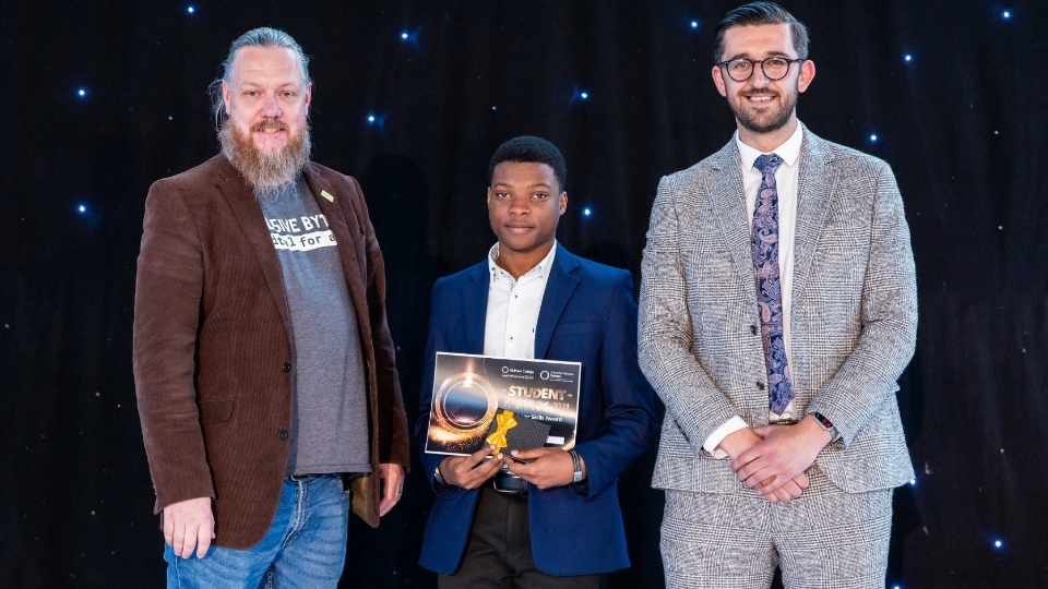 Pictured (left to right) are: Andy Powell, Director at Inclusive Bytes CIC, celebrating the success of Howard Samuel, the ‘Outstanding Skills’ award winner in Digital, with Rikki Paylor, Director at Oldham College