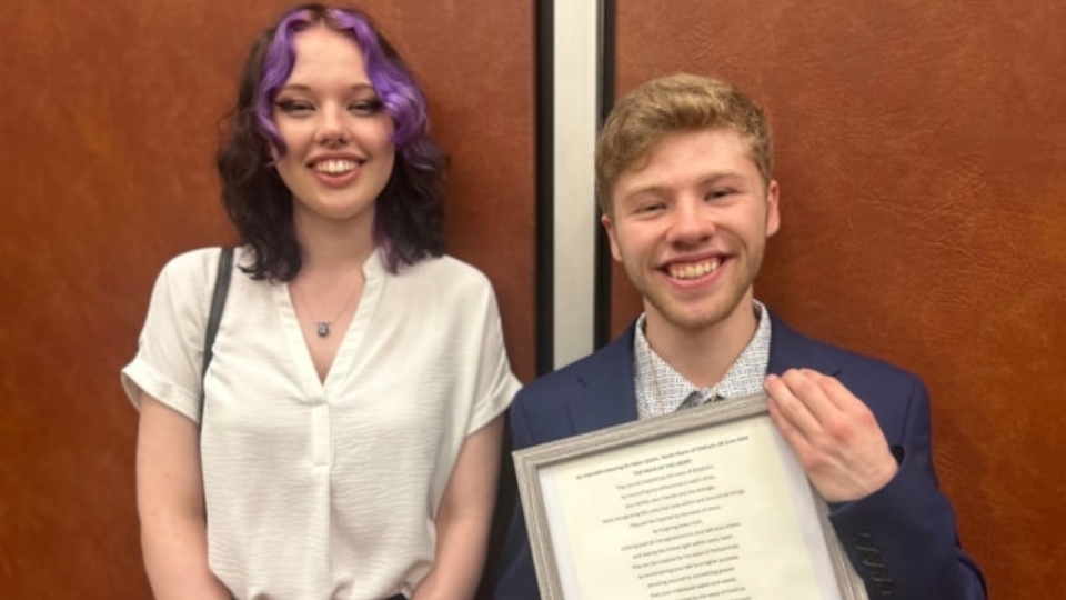 New Oldham Youth Mayor Isaac Quinn pictured with outgoing Youth Mayor Charlotte Clasby