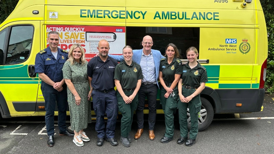 Iain Dowie (third from right) is pictured reuniting with the ambulance and helicopter crews that came to his aid