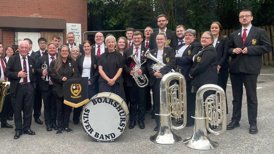 Boarshurst Silver Band was personally contacted by actress Julie Hesmondhalgh, pictured here with the band members