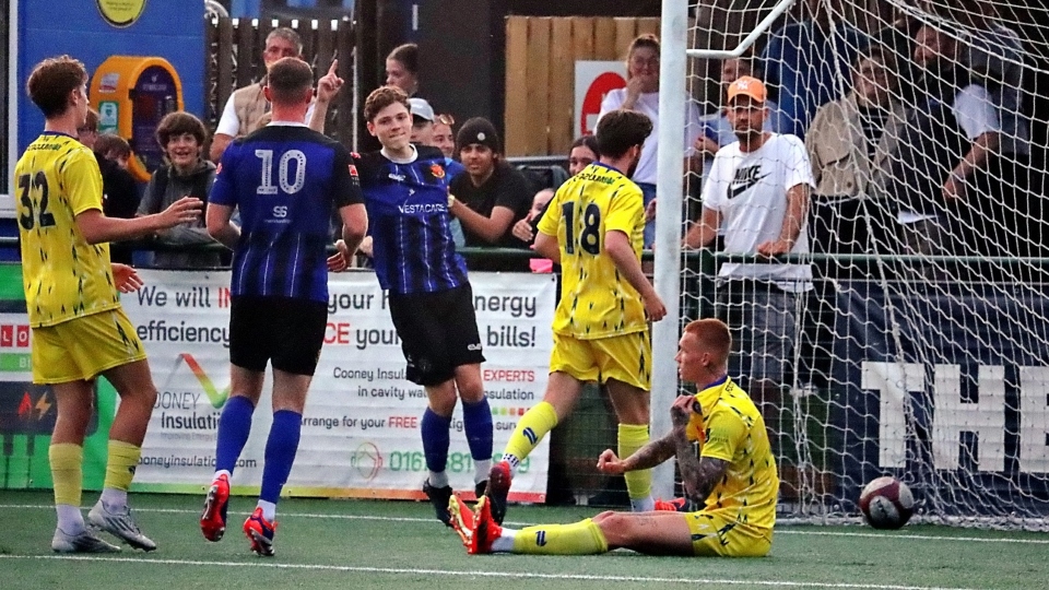 Liam Ellis slots home to secure victory. Image courtesy of Avro FC