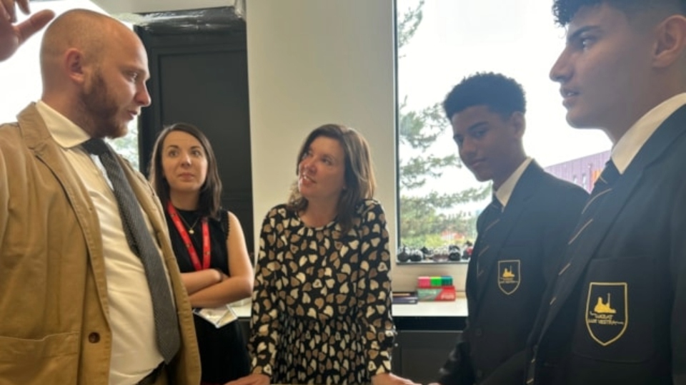 Dame Rachel de Souza pictured at the new Brian Clarke Academy with students and staff