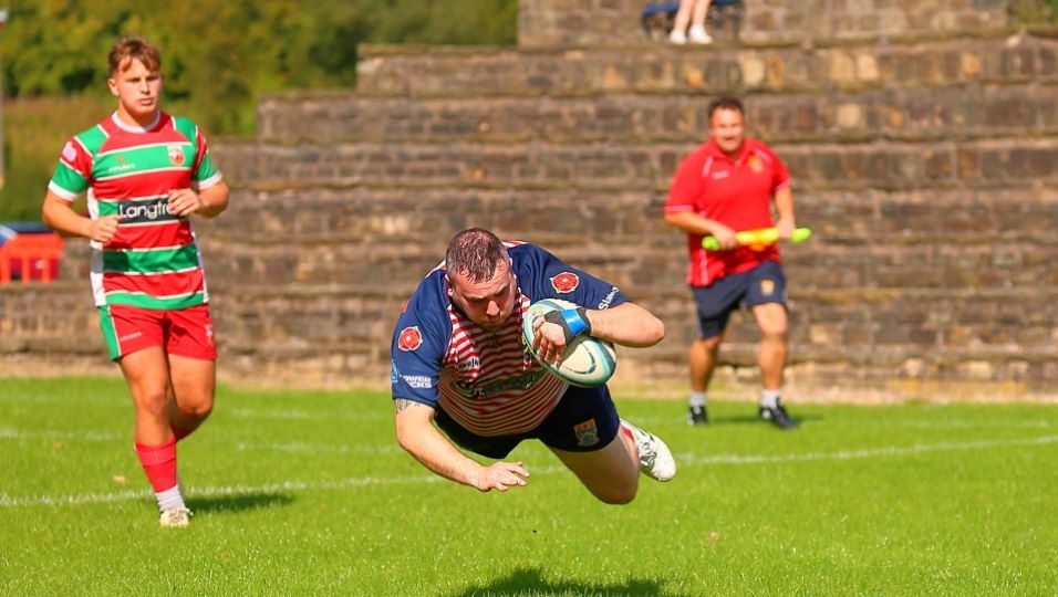 Rhys Jones dives over to score. Image courtesy of Tim Abram