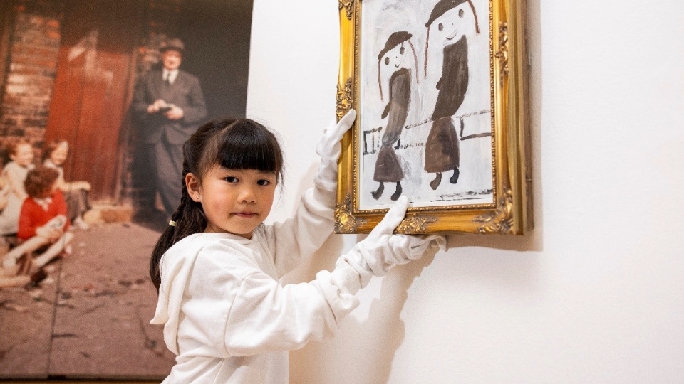 Peiqi Zhou with her painting