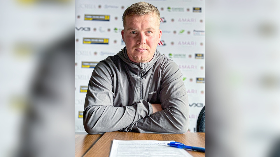 Adam Milner pictured after signing his new Oldham contract at Boundary Park. Image courtesy of ORLFC