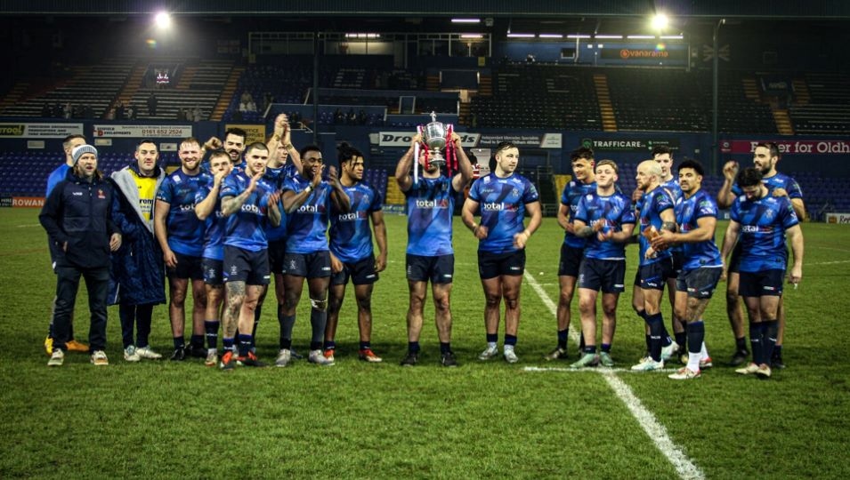 The victorious Roughyeds show off the Law Cup. Image courtesy of ORLFC