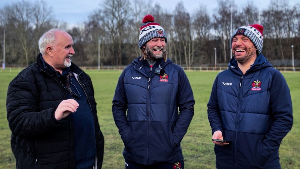 Bill Quinn is pictured (left) with Sean Long and George Riley, Oldham's head of media and communications. Image courtesy of ORLFC