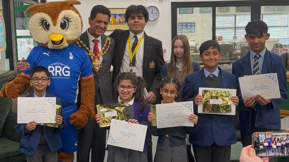 Mayor of Oldham, Cllr Zahid Chauhan, and Chaddy the Owl are pictured with the Winfield Literacy Award winners