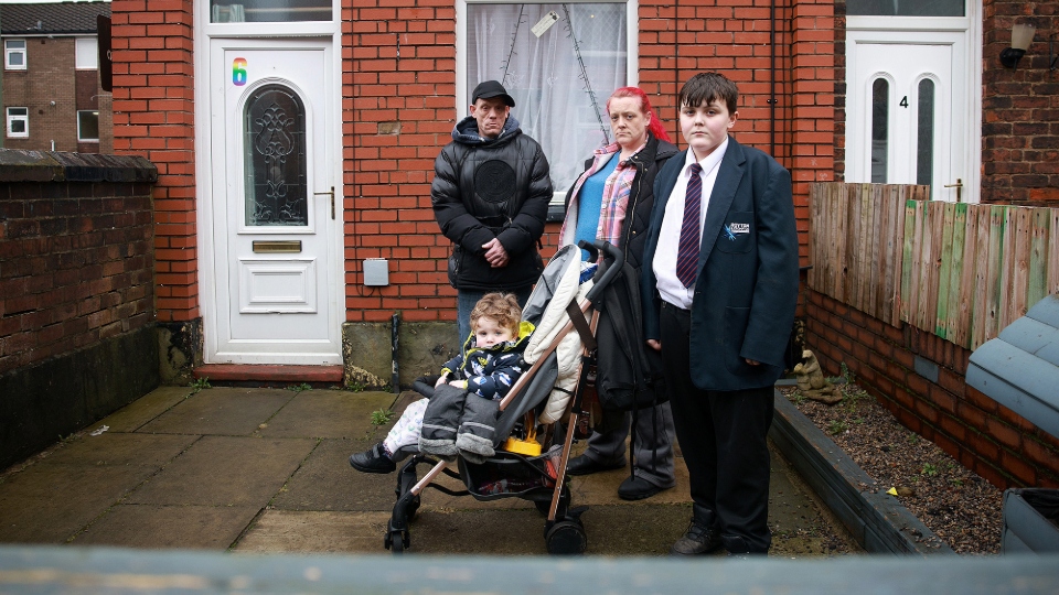 David Harvey, Leighanne, Elliot (2) and Cody (13) outside their home in Shaw. Images courtesy of Jason Hansford / MEN