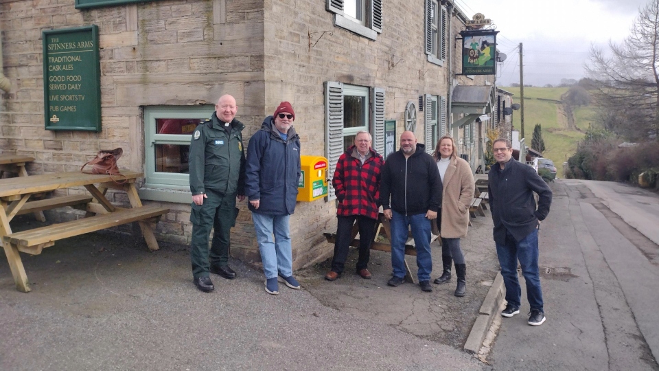 Pictured (left to right) are: Gareth Farnan-Jones, Robert Cragg and Rob Knotts (Scouthead and Austerlands Community Group), Mick Wilkin, Spinners Arms landlord, Councillor Alicia Marland and Councillor Garth Harkness