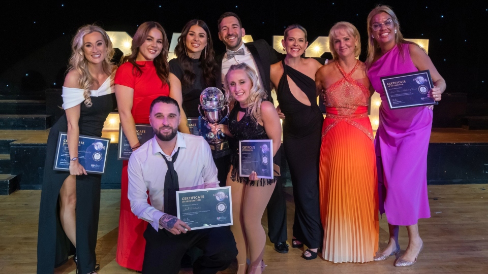 The 2025 winners, Jack Warburton and Katie Gough (centre), with the amazing dance teachers who gave up their time