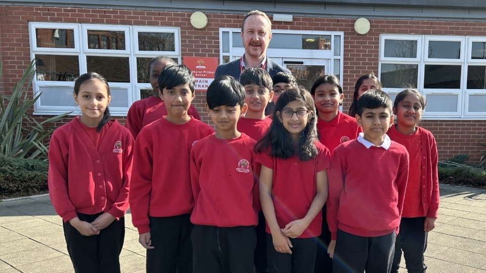 Pictured is Ewan McPherson, Interim Executive Principal at Lyndhurst Primary and Nursery School, with pupils from the school