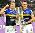 MINE’S A TREBLE: Kevin Sinfield (right) celebrates with his Rhinos team-mate Danny McGuire.