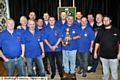 Oldham darts team and officials before their 7-3 win over Wigan at the Blue Club in Chadderton. Team manager Graham Anderson is holding the British Champions’ Cup, which Oldham lifted after victory over Yorkshire in August. 
