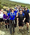 ALMOST there . . the team, which included Barrie McDermott (right) ascend Kilimanjaro