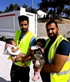 EMOTIONAL journey . . . Sajjad (right) with a volunteer from High Wycombe and Syrian orphans