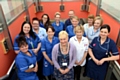 HAPPY to help . . . Cathy Allen (centre), cluster performance lead, pictured with Failsworth and Werneth community nursing team