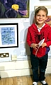 A BRUSH with fame . . . young Jacob Robinson with his painting at the Oldham Open