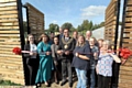 THE Mayor, Councillor Ateeque Ur-Rehman, cuts the ribbon to an open day at the popular Waterhead growing hub