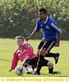 ON THE ATTACK: Westwood’s Salah Uddin tries to shake of the attention of GPO’s Damion Hirons.