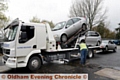 Police and licence enforcement agencies carry out Operation Considerate outside Oldham fire station on Lees Road. Vehicles were stopped for a variety of offences, including driving without insurance and driving while putting on make-up. Pic shows cars being seized for having no insurance.