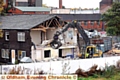 GOING . . . demolition workers get to work on the final RSPCA building on the Rhodes Bank site