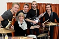 GOING out with a bang: Mrs McCormick with The Visitors (from the left) Charles Cotton, Jonny Wray, Jack Bottomley-Clift and Greg Higham