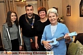 CHRISTMAS wish: Vilma Smith with her ukulele, granddaughter Emily Martin, daughter Corinne Ogden and Saddleworth Round Table chairman Matthew Sykes