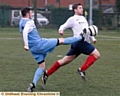 FOOT UP: Heyside’s Daniel Dunne (left) tries to halt an opponent.
