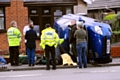 The Fiat lies on its side in Roman Road, Hollinwood