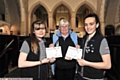 Sarah Bailey (l) and Katie Hardman-Elliot with their Baden Powell Award certificates and 46th Oldham St Anne’s guide leader Diane Jones