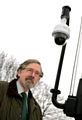 KEEPING watch . . . Councillor Andrew Fender with one of the new telescopic cameras