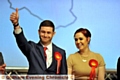 THUMBS UP: Jim McMahon salutes his supporters alongside partner Charlene as the result is announced. 