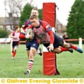 HIGH FLYER . . . Oldham’s Will Mellor dives over to score a try. 