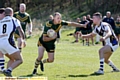 GET AWAY: Alan Williamson, of Saints fends off a would-be Blackbrook tackler. PICTURE: PAUL STERRITT.