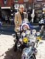 Owner Mick Harwood with classic scooter. 