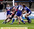 REACH OUT . . . Gareth Owen scores Oldham’s fourth and final try with three minutes to go.