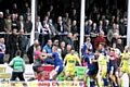 TOUCHLINE TEMPERS . . . the home crowd get a close-up view as Barrow and Oldham players square-up in the later stages of a fiercely-contested Kingstone Press League One clash at Craven Park. PICTURE by DAVE MURGATROYD