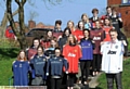 Oldham Hulme Grammar School students, who are heading to Ghana in July, with donated football shirts