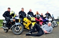 BIKER gang . . . (from left) Marc Ratcliffe, Scott Roberts, Lee Croston, Stephanie Ratcliffe, Ryan Bateson, Mick Croston and (lying down) his son Pete who will be riding a support vehicle