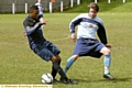 ACTION STATIONS . . . Fitton Hill’s Mark Hope (left) charges in to challenge Heyside’s Chris Ollerton in the Jack Abbott Premier Division Shield final.
