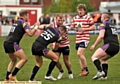 GETTING TO GRIPS: Danny Langtree prepares to be tackled by Thunder’s Evan Simons.