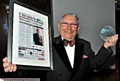 GLOWING with pride . . . Norman Stoller with his award