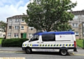 Police outside the flats on Middleton Road in Chadderton.