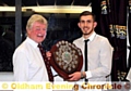 HONOUR: Ryan North picks up the players’ player award from Oldham RUFC president Brian Smith.