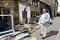 Karl Highton surveys the damage to his house