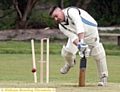 CRASH OF ASH . . . Shaw’s Pip Taylor is bowled by Saddleworth’s Dave Roberts. 