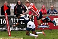 TAKING TO THE AIR: Oldham’s George Tyson leaps over a defender to score against Oxford.